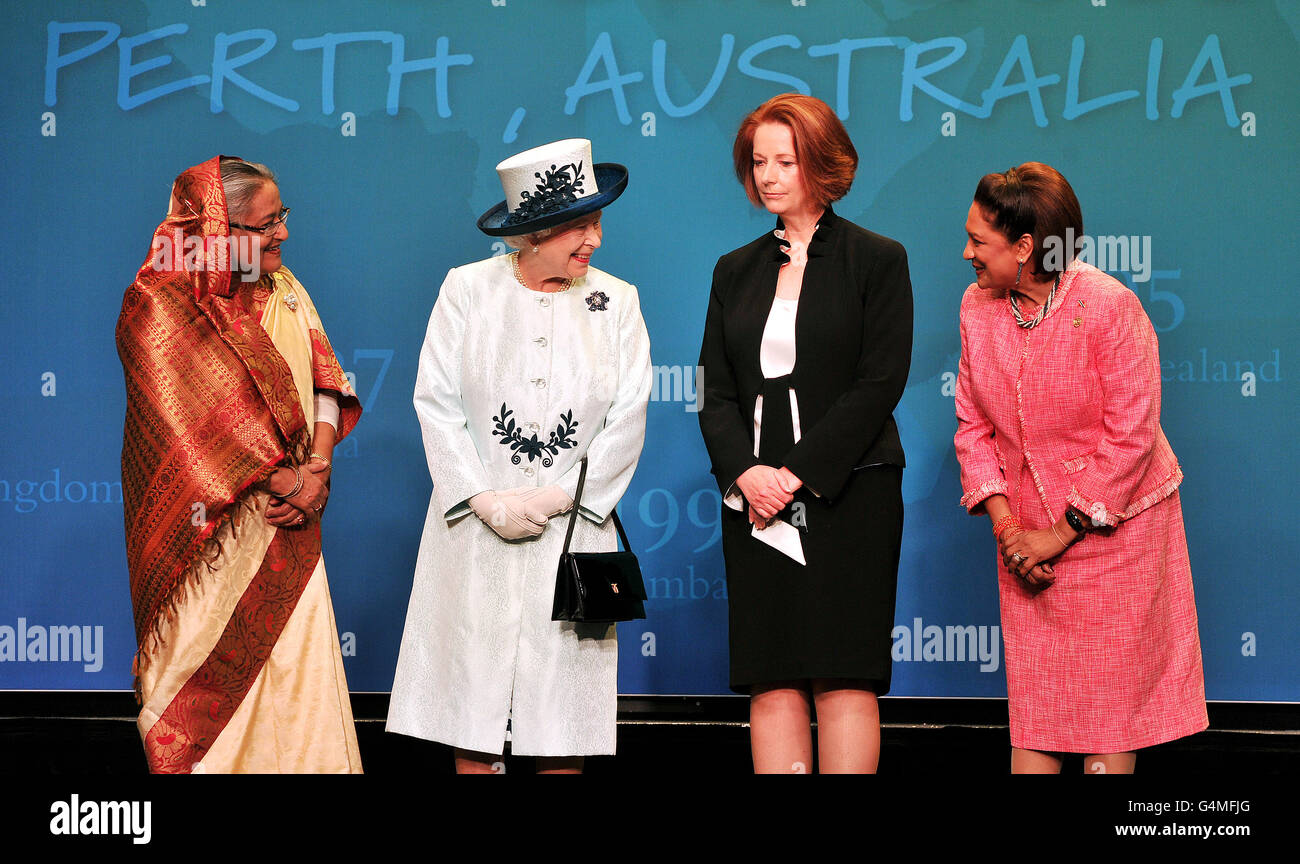Queen Elizabeth II (second left) stands with the Prime Ministers of Bangladesh, Sheikh Hasina (left), Australia, Julia Gillard (second right) and Trinidad & Tobago, Kamla Persad-Bissessar, during the opening of 2011 CHOGM (Commonwealth Heads of Government Meeting) in western Australia in Perth. PRESS ASSOCIATION Photo. Picture date: Friday October 28, 2011. The meeting brings together heads of government from across the 54-country group. See PA story ROYAL Commonwealth. Photo credit should read: John Stillwell/PA Wire Stock Photo