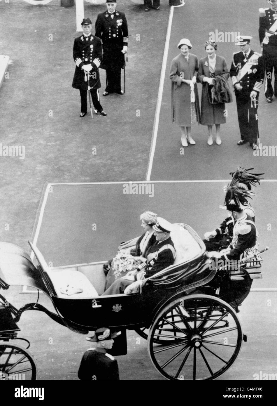 The Duke of Edinburgh, Queen Ingrid and Princess Margrethe of Denmark watch as the Queen drives off in an open carriage with King Frederik IX for a drive to Amelienborg Palace. Stock Photo