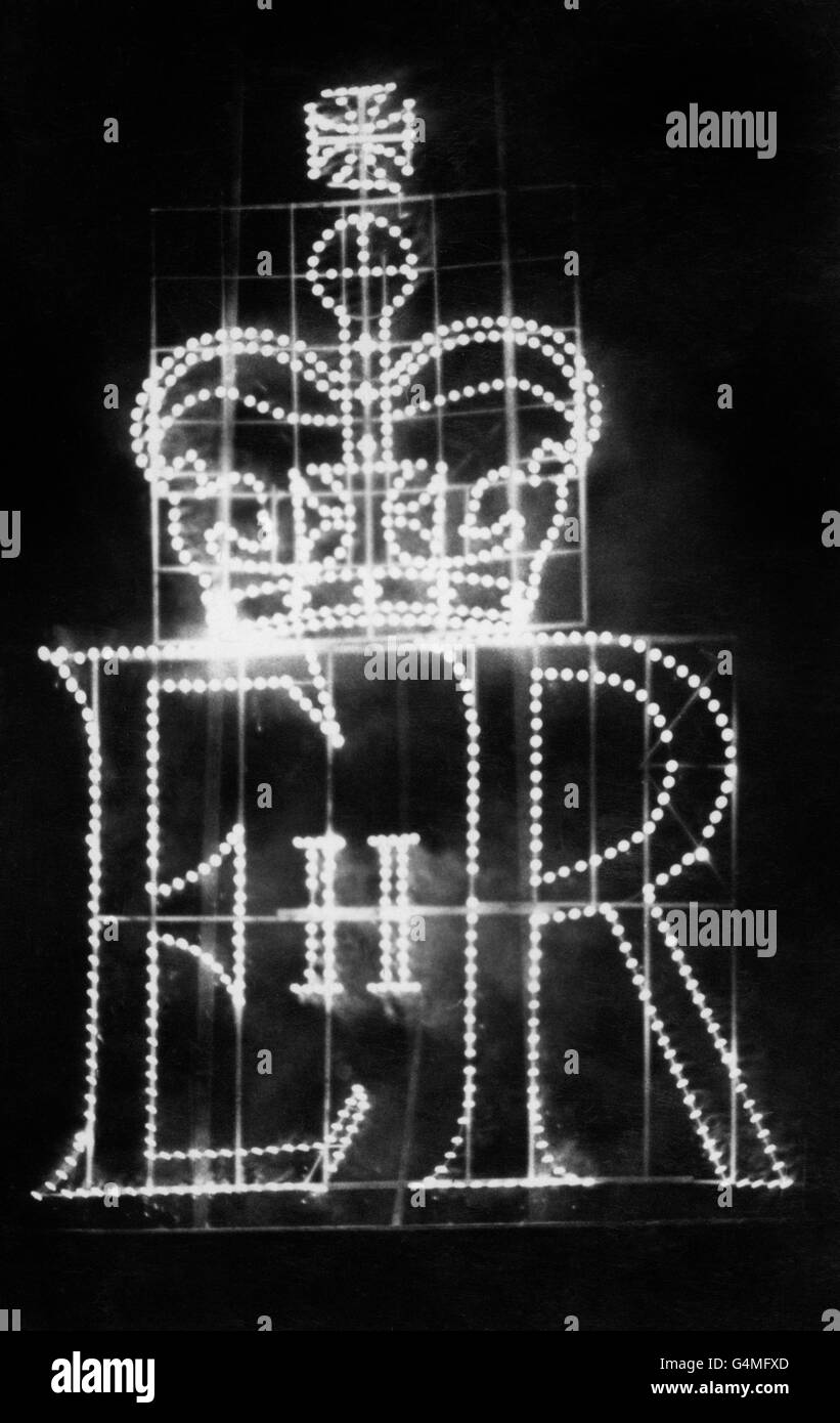The British Royal cypher glows in a setpiece 15 metres high during the fireworks display on the opposite side of Copenhagen Harbour which followed the dinner given by the Queen and the Duke of Edinburgh on board the Royal Yacht Britannia for King Frederik and Queen Ingrid of Denmark. Stock Photo