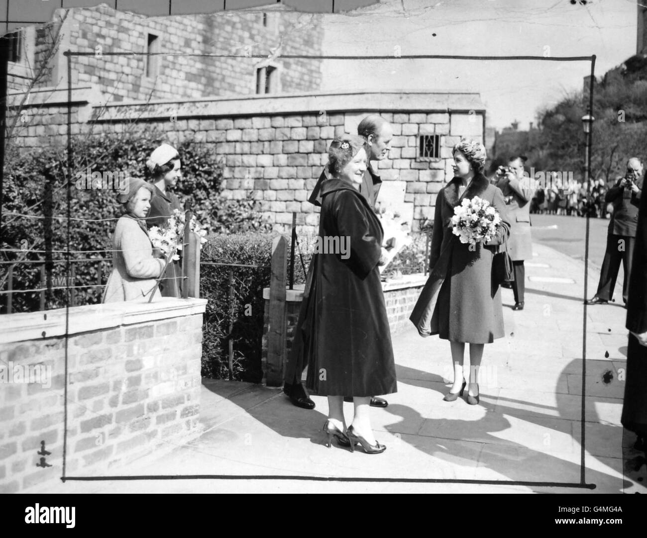 **Scanned low-res off contact** Queen Elizabeth II, the Queen Mother and Princess Margaret with the Dean of Windsor, Bishop Eric Hamilton, leaving the Deanery after the distribution by the Queen in St. George's Chapel, Windsor, of the Royal Maundy - Britain's oldest royal charity. Stock Photo