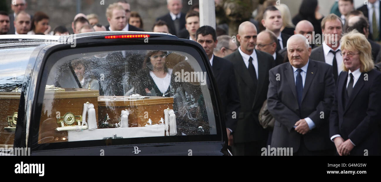 Mourners look on as the coffins of Bridget Sharkey and her brother Thomas Sharkey arrive at St Joseph's Church in Helensburgh ahead of their funeral. Stock Photo