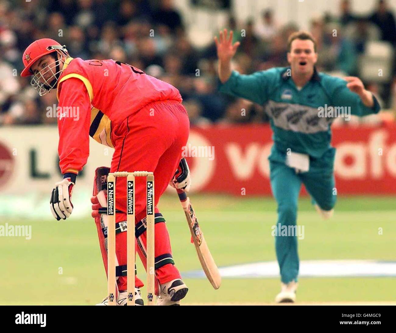 Alistair Campbell the Zimbabwe Cricket Captain (left) watches the ball as New Zealand bowler Dion Nash closes in during their Super Six Cricket World Cup Match at Headingley, Leeds. Stock Photo