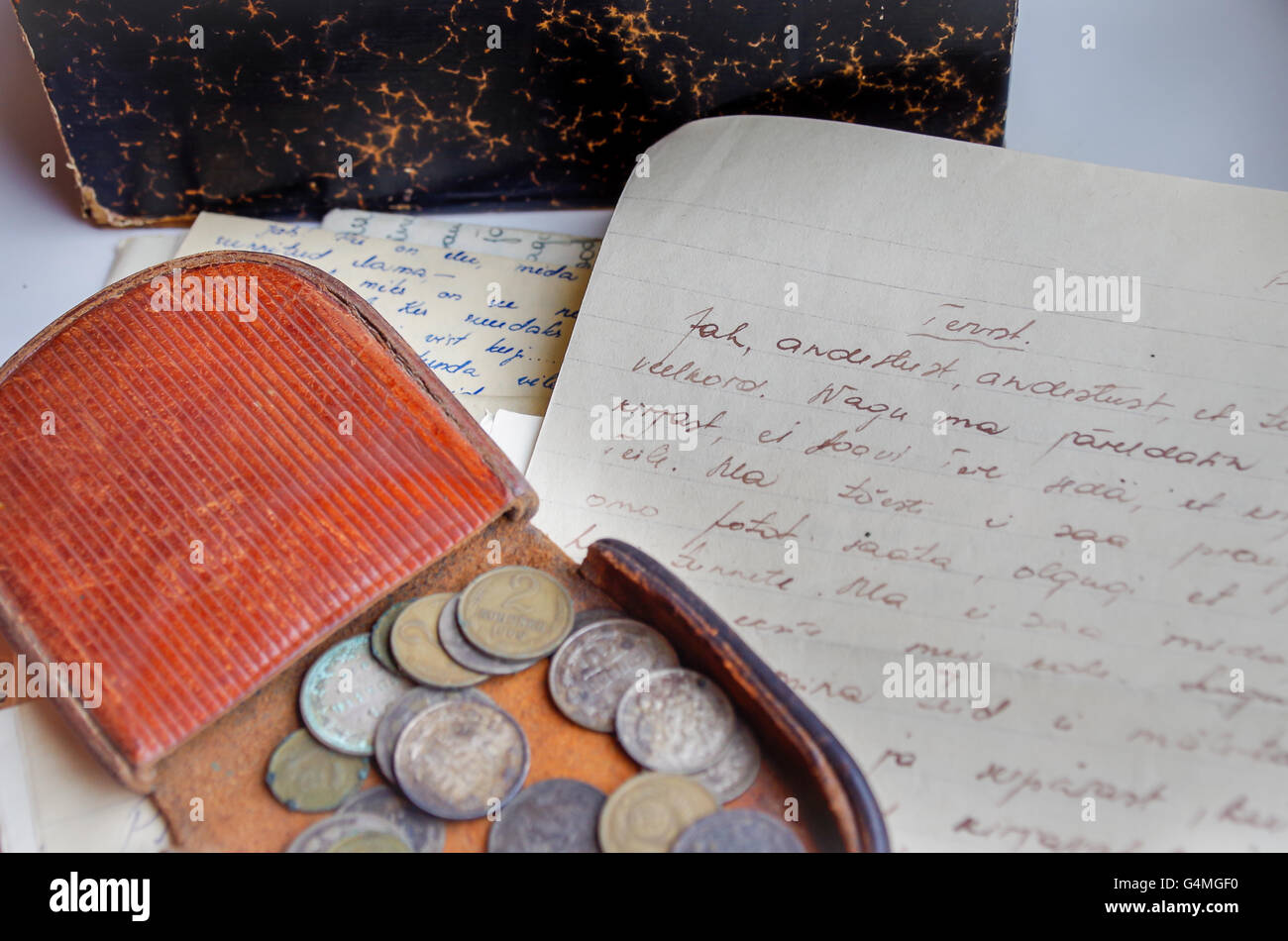 Leather coin pouch with coins from the Russian Empire and handwritten love letters from 1930s Stock Photo