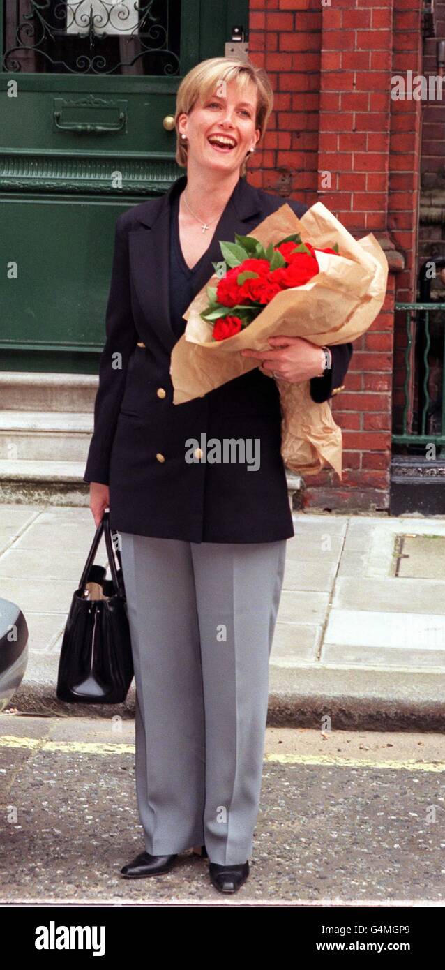 Royal bride-to-be Sophie Rhys-Jones, leaves her office, R-JH Public Relations, in Mayfair, central London, holding two dozen red roses, bought for her by photographers, on her last day at work before she marries Prince Edward. * She is understood to be taking tomorrow and next week off work to prepare for the Royal Wedding at Windsor on June 19 1999. Stock Photo