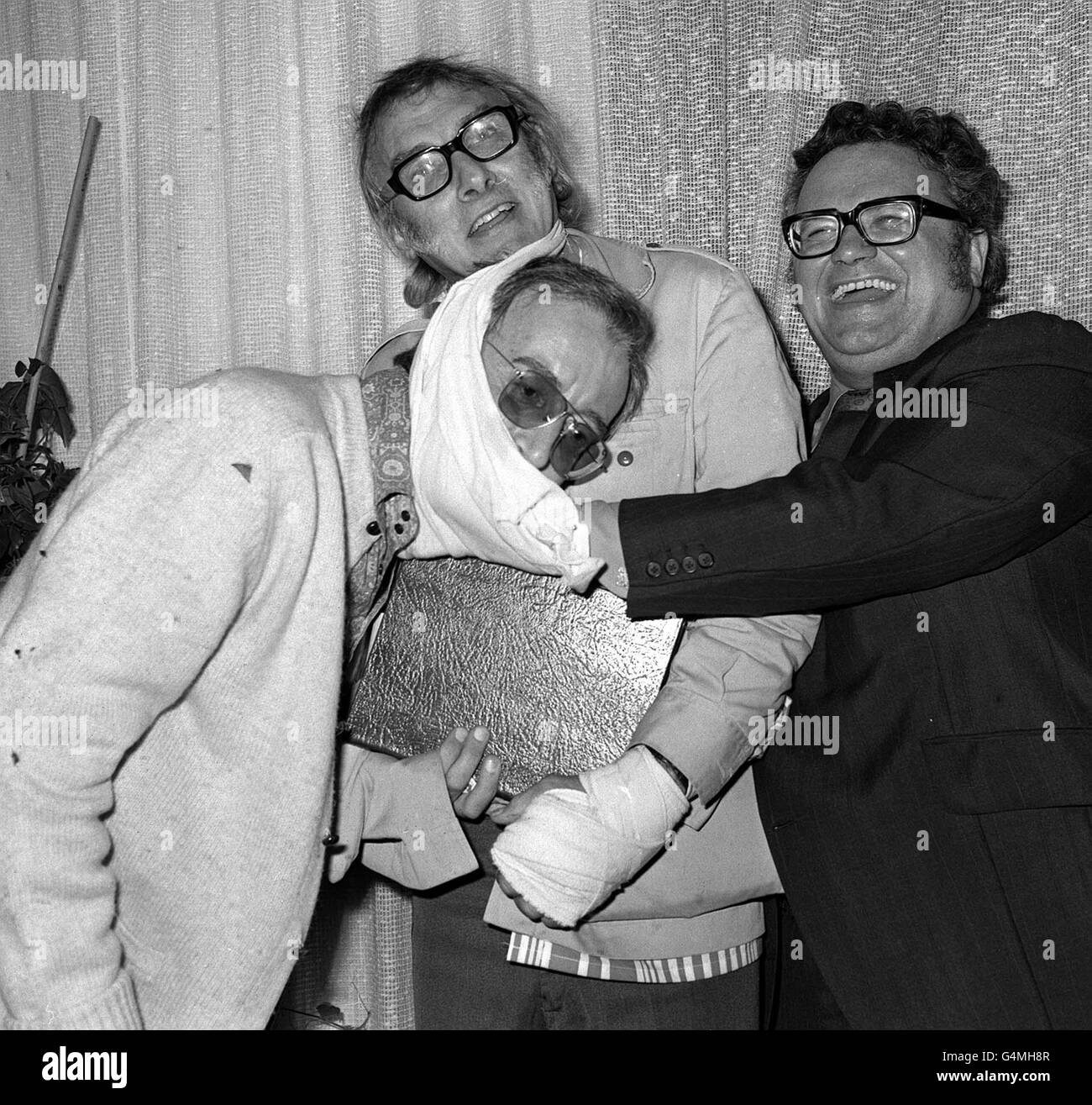 Goons (L-R) Peter Sellers, Spike Milligan and Harry Secombe at a London reception to launch the book 'The Goon Show Scripts', which contains original scripts of the radio series and drawing by all three Goons. *27/02/02: Spike Milligan died early today at his home in Sussex, his agent said. Stock Photo