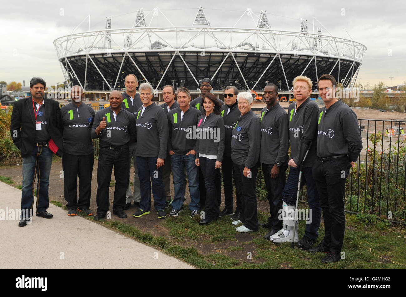 Laureus World Sports Academy members (from left to right) Kapil Dev, Kip Keino, Marvin Hagler, Sir Steve Redgrave, Mark Spitz, Hugo Porta, Mick Doohan, Edwin Moses, Nadia Comaneci, Ilie Nastase, Dawn Fraser, Michael Johnson, Boris Becker and Michael Vaughan during the photocall at the The Greenway, Stratford. Stock Photo