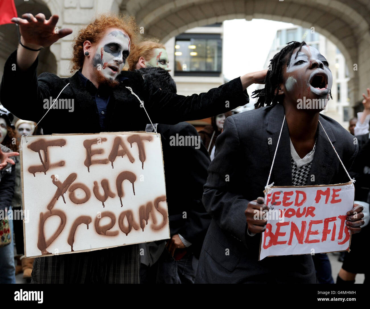 Protesters dressed as a zombie bankers for Halloween during a march around London banking district, as part of the Occupy London Stock Exchange protest. Stock Photo