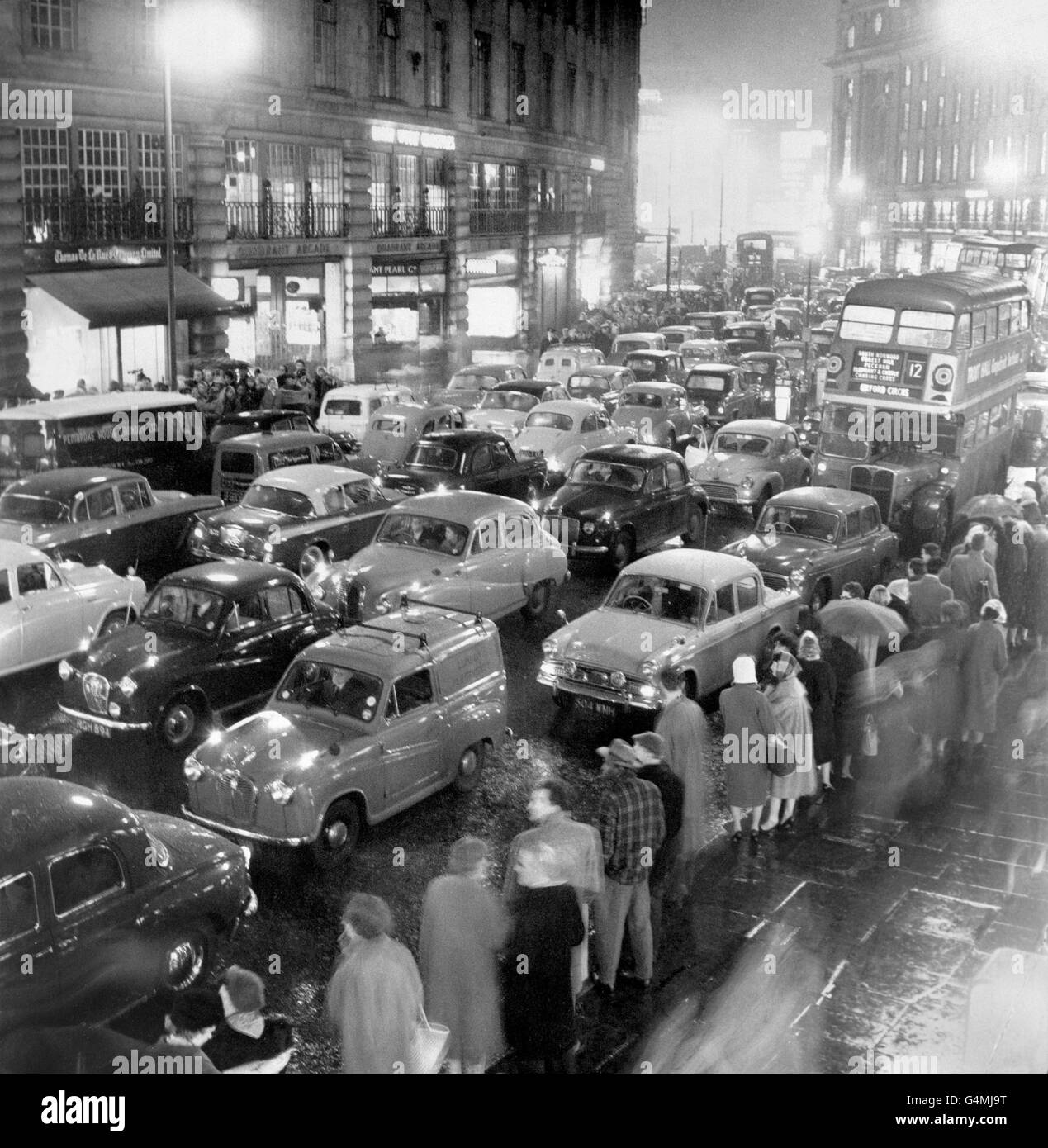 Long lines of cars stretch through the heart of London during the 24-hour rail strike. London had unprecedented traffic jams as commuters would not risk uncertainty over the rail service and underground tubes. A newspaper van can be seen carrying the banner 'Strike Scenes'. Stock Photo