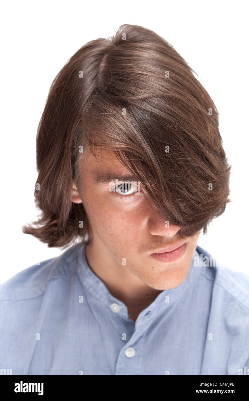 portrait of teen with long surfer haircut isolated on white, focus on hair Stock Photo