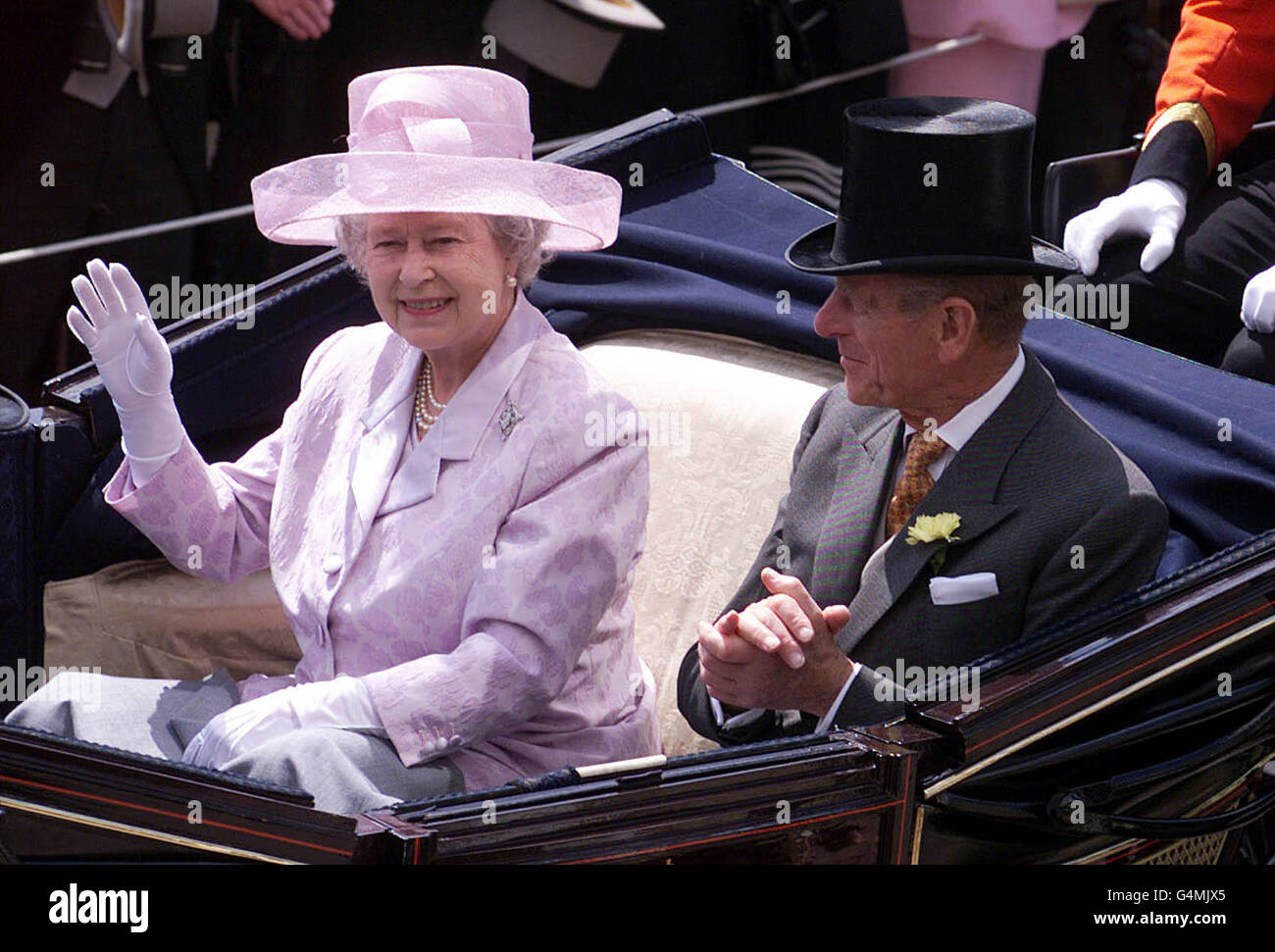 The Queen and the Duke of Edinburgh arrive in an open topped carriage, in the Royal enclosure at Ascot, to watch the first day's action of the annual race meeting. Stock Photo