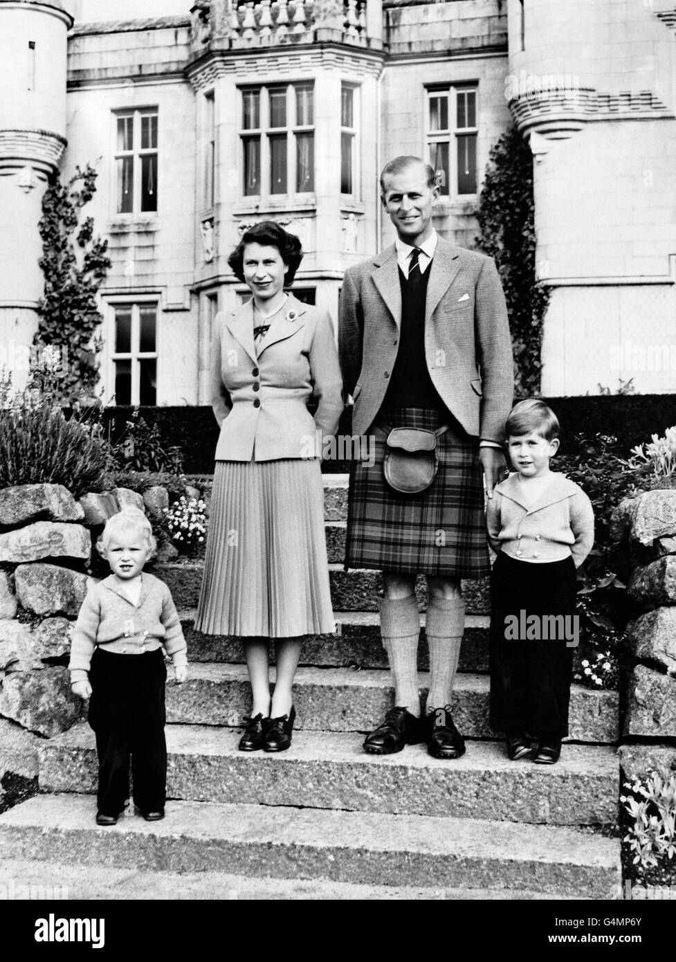 Queen Elizabeth II with the Duke of Edinburgh and their children, Princess Anne, left, and Prince Charles at Balmoral Castle. Stock Photo