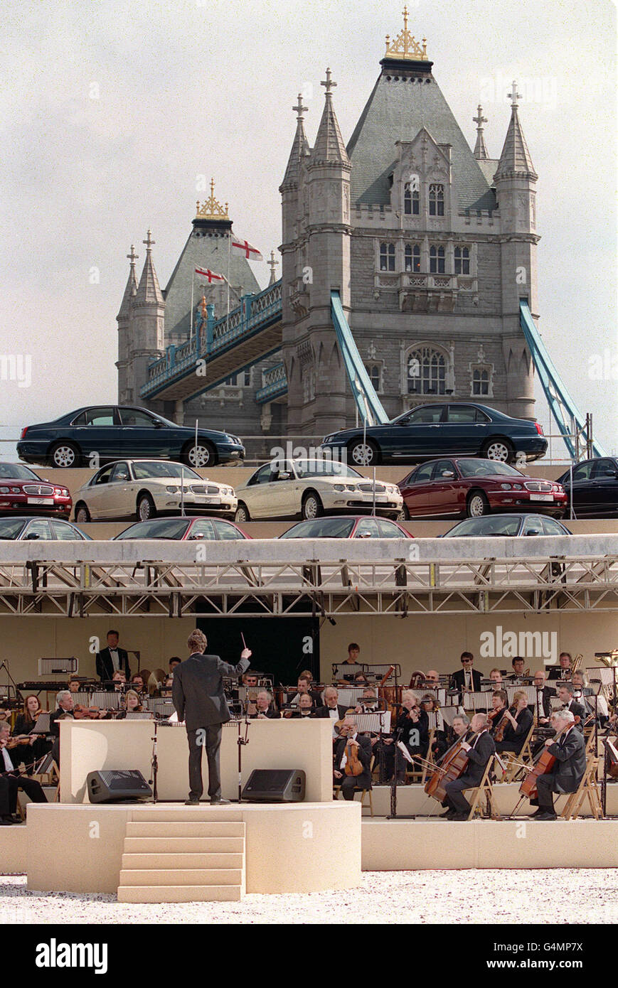London's Tower Bridge makes an impressive backdrop for the launch of the Rover 75. The Royal Philharmonic Concert Orchestra also played a 10-minute piece written and composed by Eurythmics rock star Dave Stewart to mark the launch of the new vehicle. * which is the result of a four-year, 700 million investment programme that BMW-owned Rover hopes will halt its recent sales slump. Stock Photo