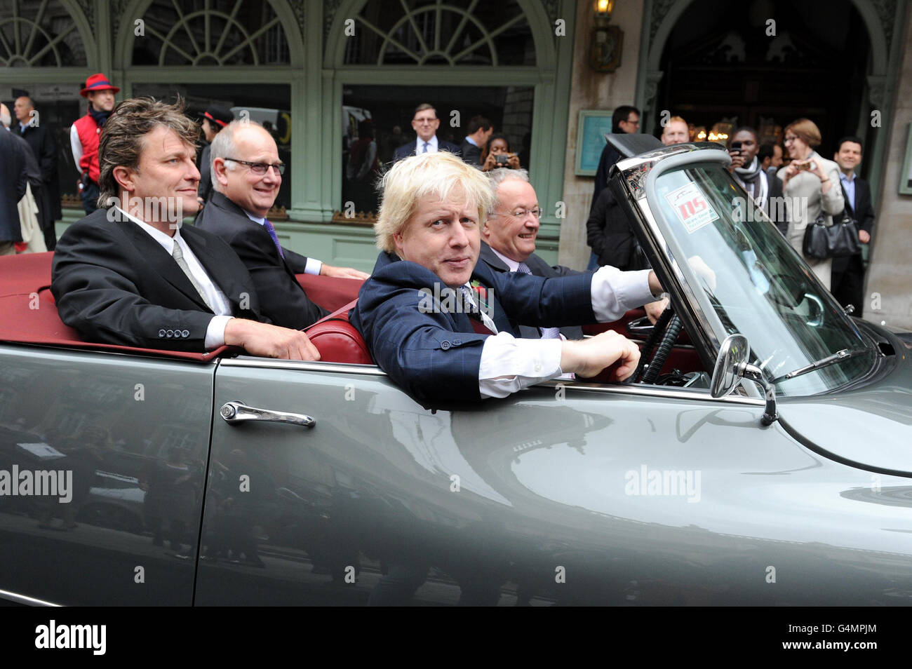 The Mayor of London, Boris Johnson drives down Piccadilly in an open top 1960s Citroen to mark the completion of a &pound;14 million investment in the area as two-way traffic returns to the road for the first time since the early 1960s. Stock Photo