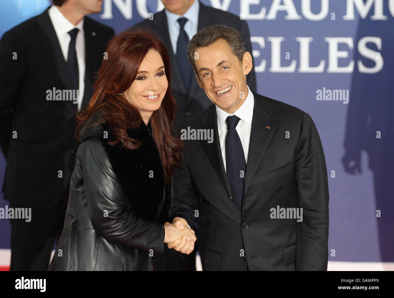 President of Argentina Cristina Fernandez de Kirchner is welcomed by the French President Nicolas Sarkozy to the G20 in Cannes, France. Stock Photo