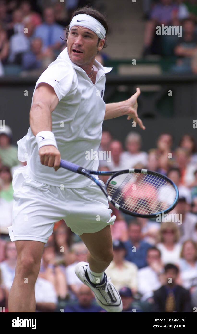 No Commercial Use. Spain's Carlos Moya in action during his match with America's Jim Courier at WImbledon. Courier defeated Moya. Stock Photo