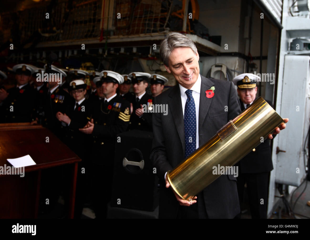 Defence Secretary Philip Hammond prepares to speak onboard HMS Liverpool as it returned to its base of Portsmouth, Hampshire, after Mr Hammond congratulated the Royal Navy for its 'momentous' role in helping defeat Gaddafi's troops in Libya. Stock Photo