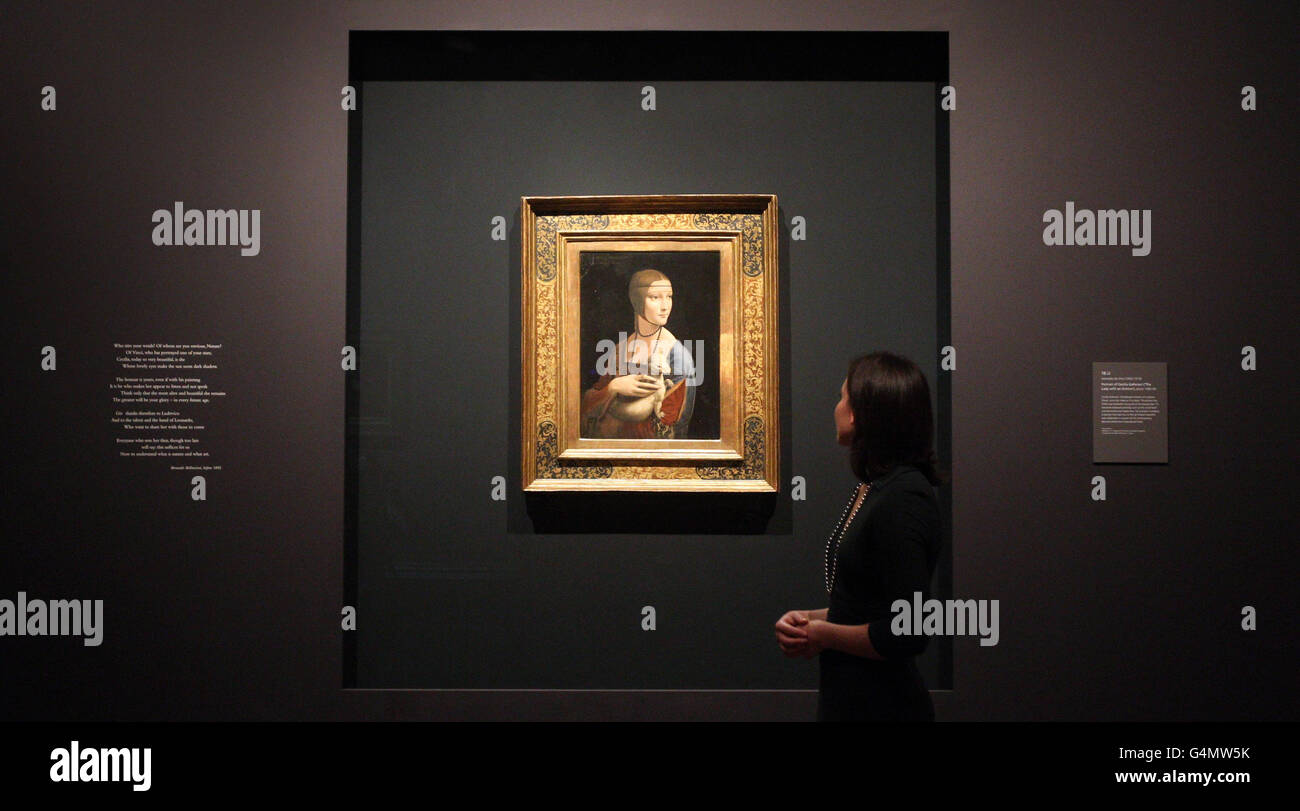 A gallery worker views Leonardo da Vinci's portrait of Cecilia Gallerani entitled 'The Lady with an Ermine' at the National Gallery's landmark exhibition, Leonardo da Vinci: Painter at the Court of Milan. Stock Photo