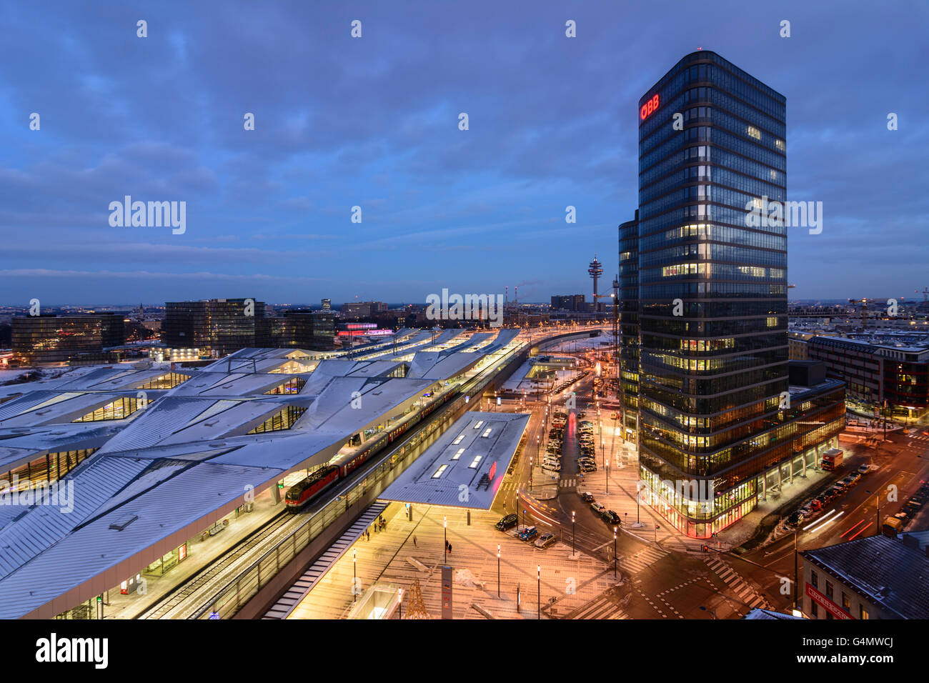 Railway Station Wien Hauptbahnhof (Vienna Central Station) ÖBB at night and  snow , with train, ÖBB headquarters, Austria, Wien Stock Photo - Alamy