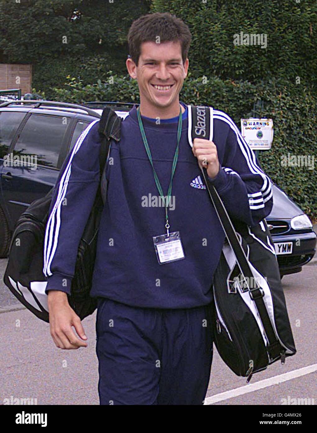 Britain's Tim Henman smiles as he arrives at the Wimbledon Tennis Championships for his match against American Jim Courier. Stock Photo