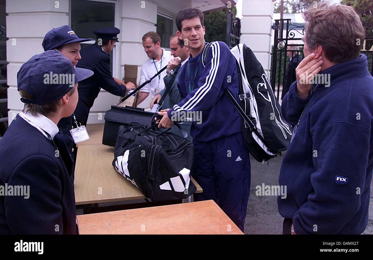 No Commercial use: Britain's Tim Henman has his bags checked as he arrives at the Wimbledon Tennis Championships for his match against American Jim Courier. Stock Photo