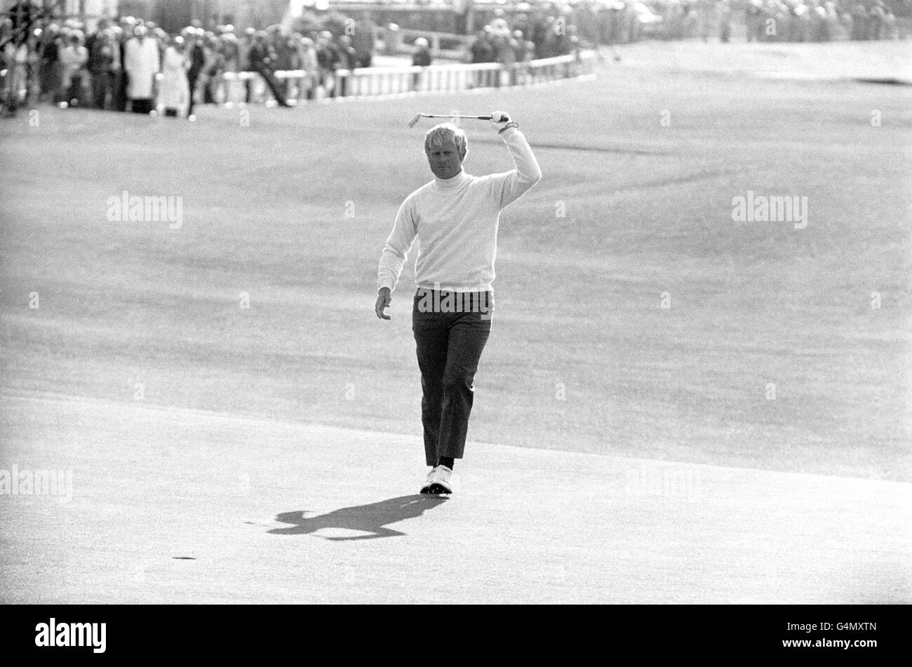 Jack Nicklaus swings his putter around on the 18th after returning with a seven under par in the Open golf championship at St Andrews. Nicklaus tied with Doug Sanders and will play off after 18 holes. Stock Photo