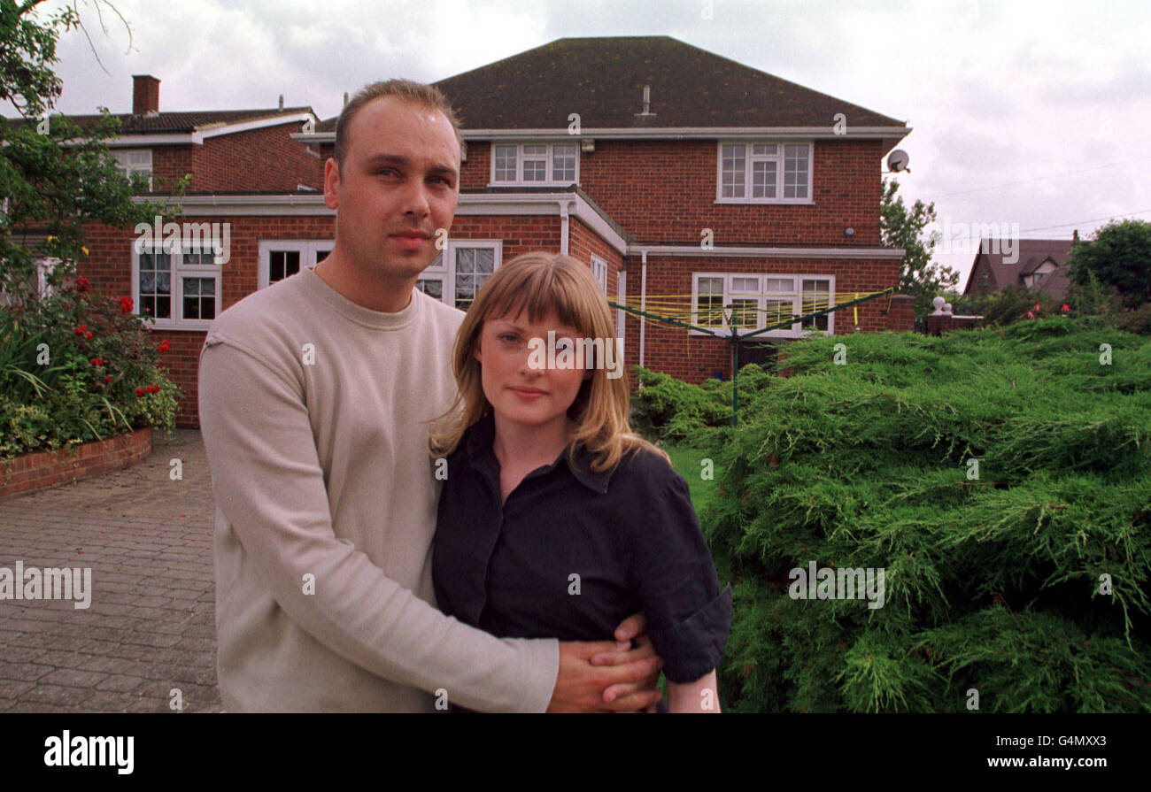 Danielle Miller comforted by her fiance Stuart McKenenzie outside her father's 550,00 Bulphan, Essex home. Twenty year old Danielle told of her horror when she awoke to find a masked intruder in her bedroom holding a sawn-off shotgun againt her head. Stock Photo