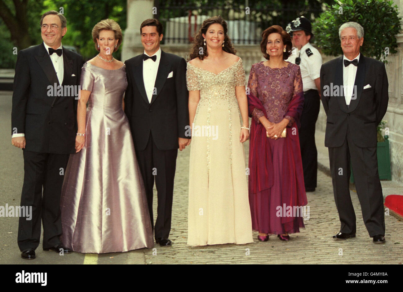 Princess Alexia, daughter of King Constantine, the former King of Greece and her fiance Carlos Morales Quintana arrive with their parents for a gala ball before their wedding on Friday 9 July 1999. * From left: King Constantine and Queen Anne-Marie, Carlos Morales Quintana, Princess Alexia, Mrs Maria Teresa Quintana and Mr Luis Miguel Morales. Stock Photo