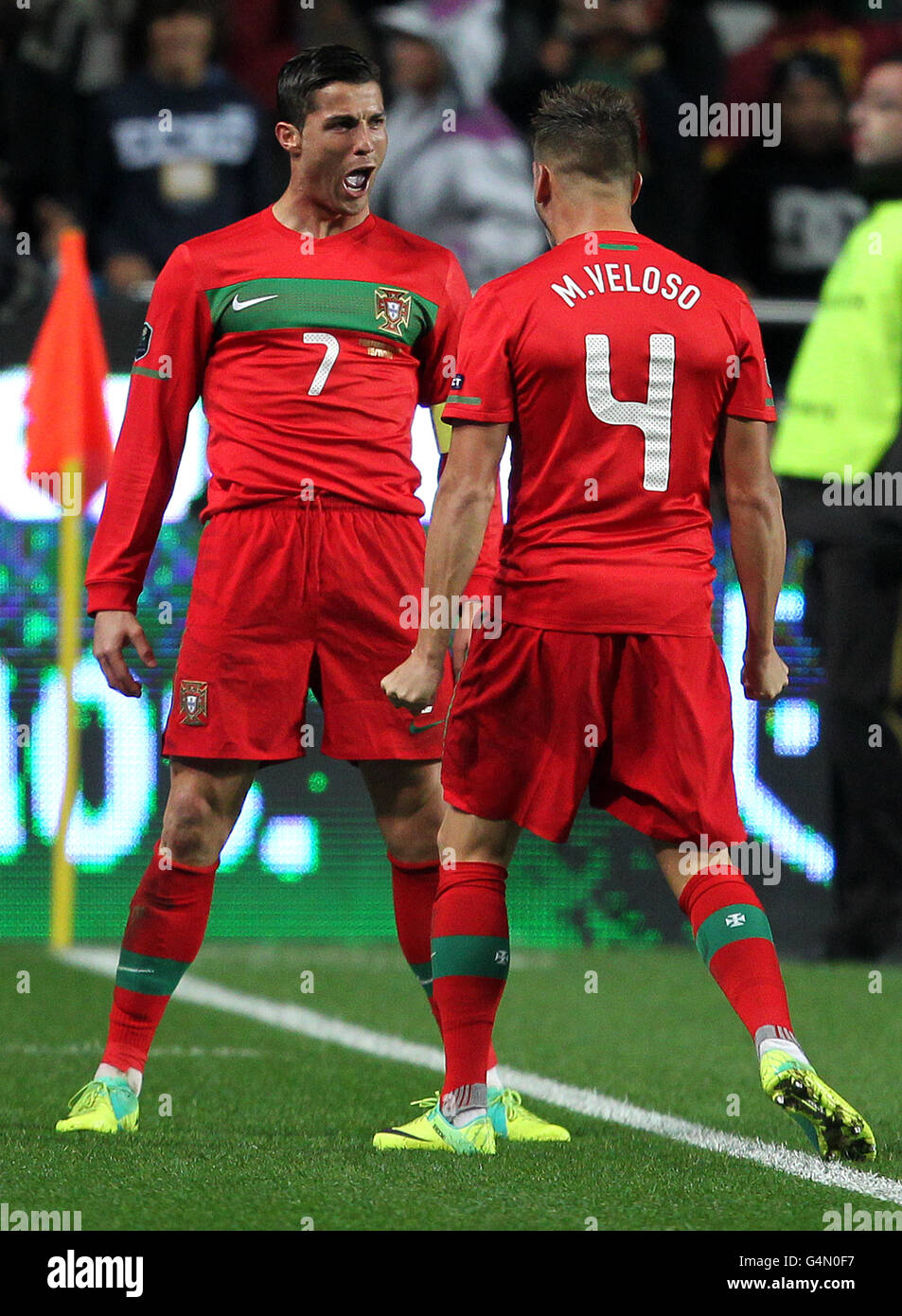 Portugal's Cristiano Ronaldo celebrates scoring the third goal with Miguel Veloso Stock Photo