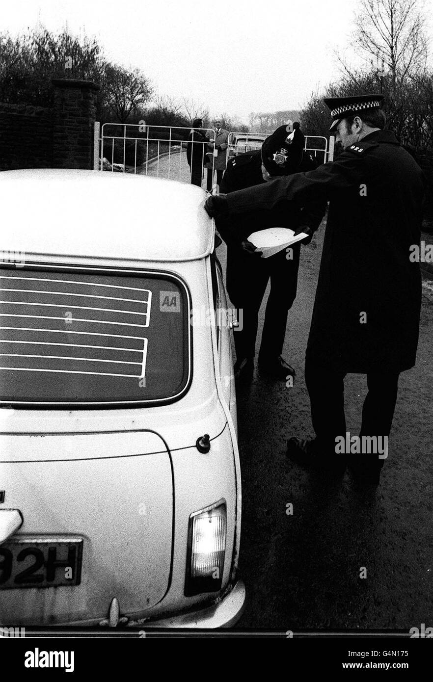 Police stationed outside the locked gates checking the identities of mourners arriving at the Chesterfield crematorium where, the funeral was taking place of Richard Moran, his 10-year-old daughter and his parents-in-law, all knifed by runaway prisoner William Hughes. * at the Moran family cottage. Stock Photo