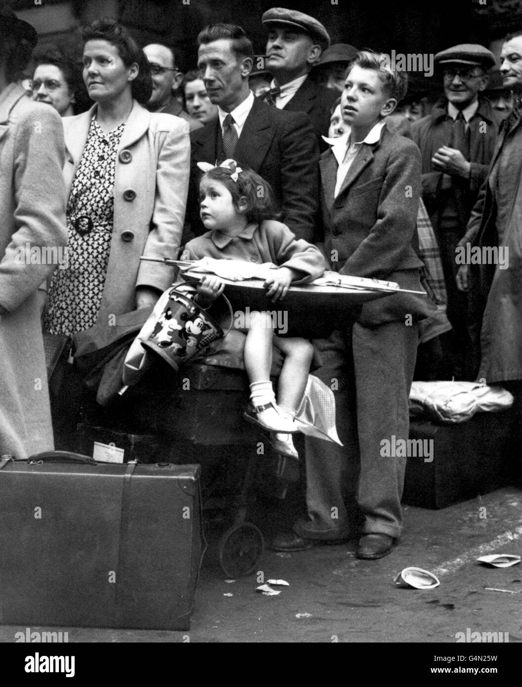 Little Valerie Willerby, aged 12, waits in the queue for the Isle of Wight train at Waterloo Station, London, as she and a large crowd of other people are anxious to spend their August Bank Holiday on the South Coast. Stock Photo