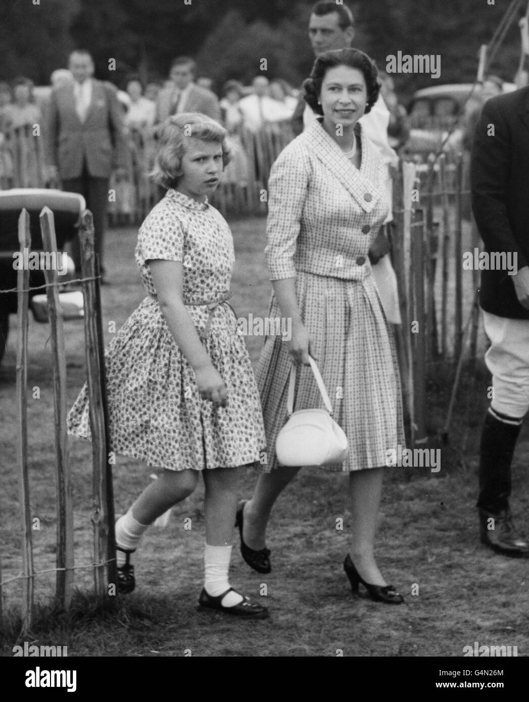 Princess Anne walks with Queen Elizabeth II at Smith's Lawn, Windsor Great Park, where they saw the Duke of Edinburgh play in a polo match. Stock Photo
