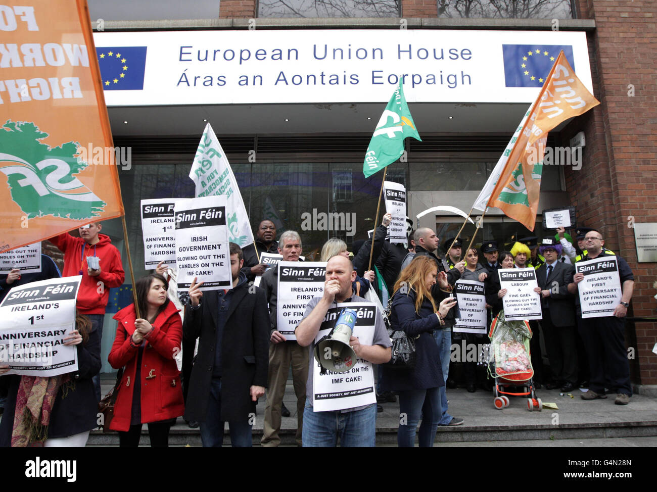 Sinn Fein activists mimicking IMF officials as they picket the European Union headquarters in Dublin as Ireland marks the one year anniversary of the EU/IMF bailout loan. Stock Photo