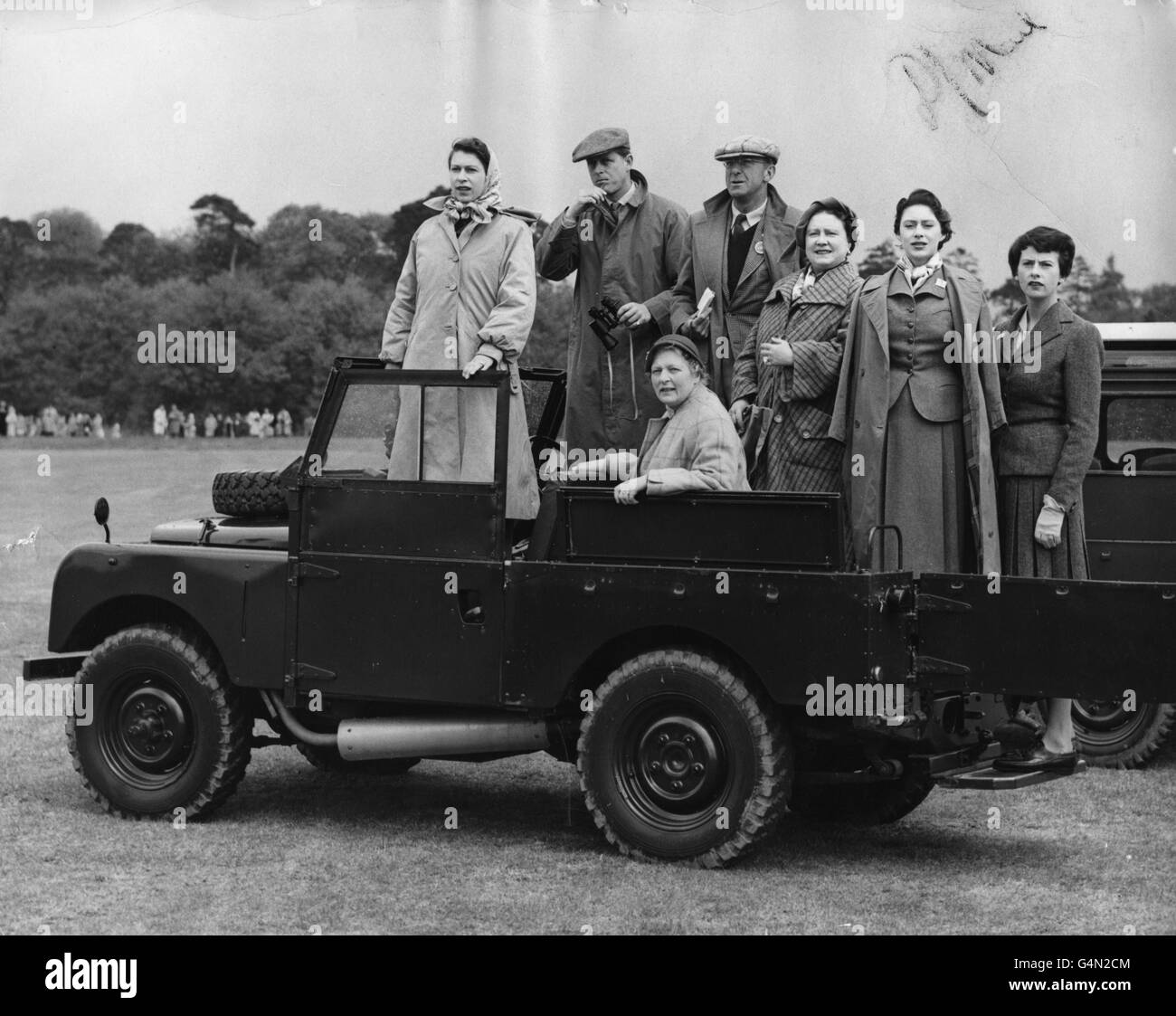 Queen Elizabeth II with, left to right, the Duke of Edinburgh, the Duke of Beaufort (Master of the Horse), the Duchess of Beaufort (seated), the Queen Mother and Princess Margaret, use a Land Rover as a 'grandstand' as they watch competitors in the cross-country section of the European Horse Trials in Windsor Great Park. Stock Photo