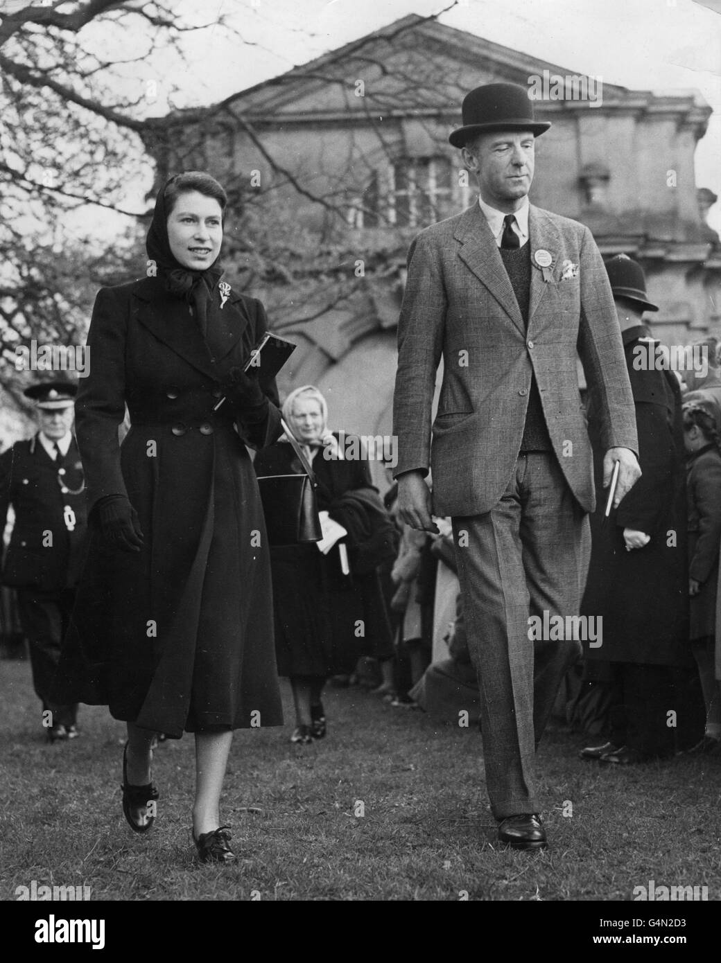 Queen Elizabeth II, walks with the Duke of Beaufort, at the Olympic Horse Trials at Badminton, Gloucestershire. Stock Photo