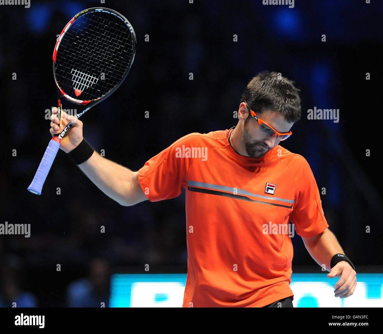 Serbia's Janko Tipsarevic reacts on his way to defeat by the Czech Republic's Tomas Berdych during the Barclays ATP World Tour Finals at the O2 Arena, London. Stock Photo