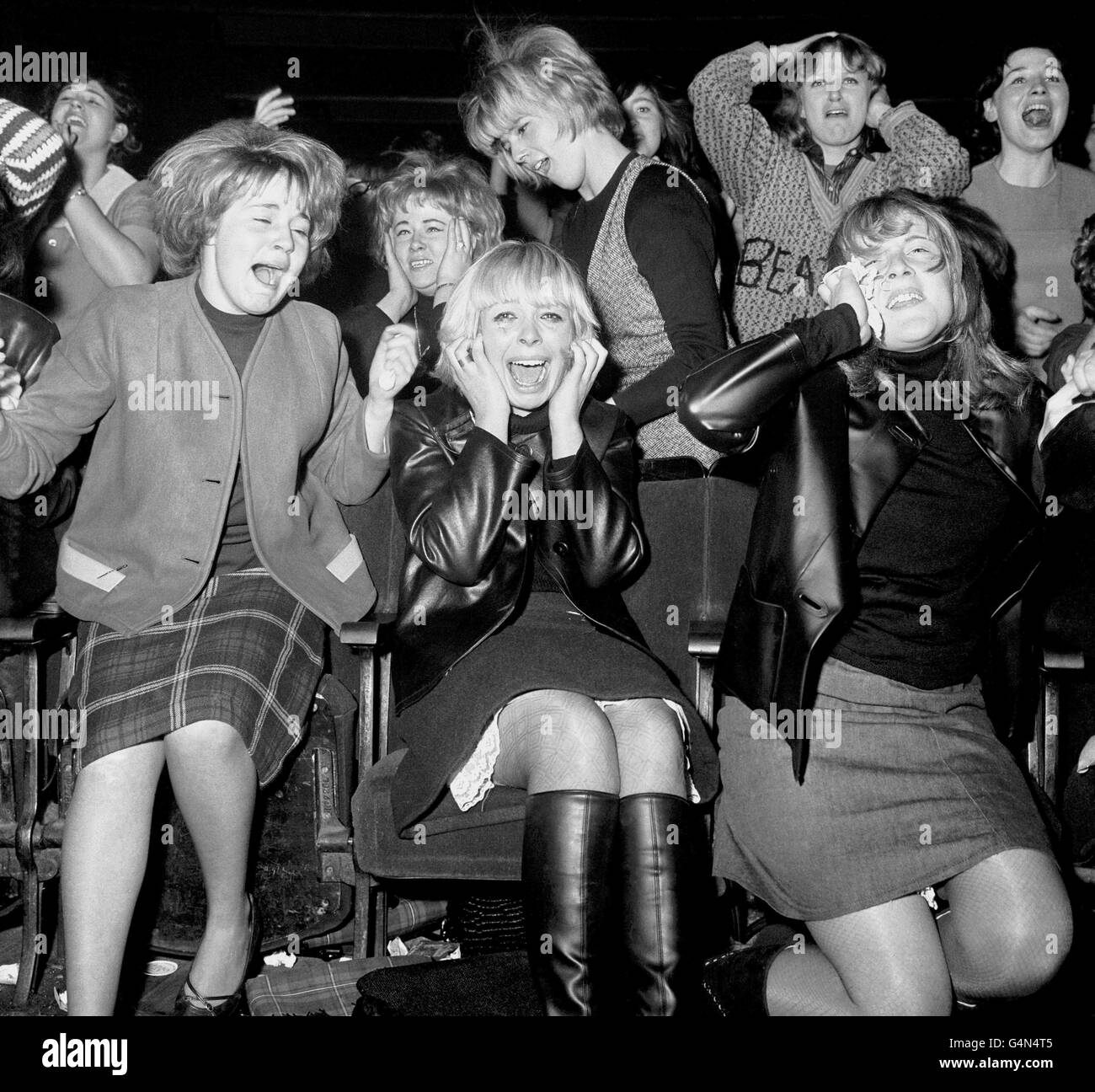 The Beatles Concert - Manchester - 1963. Screaming female fans of the pop group, The Beatles, at one of their concerts in Manchester. Stock Photo