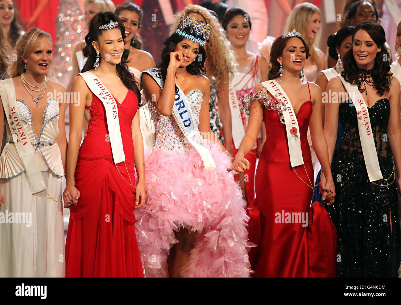 Miss Scotland, Jennifer Reoch (right) stands on stage with Ivian Lunasol Sarcos Colmenares, 21,(centre) from Venezuela, crowned as winner of Miss World at the 2011 Miss World final from Earls Court in London. Stock Photo