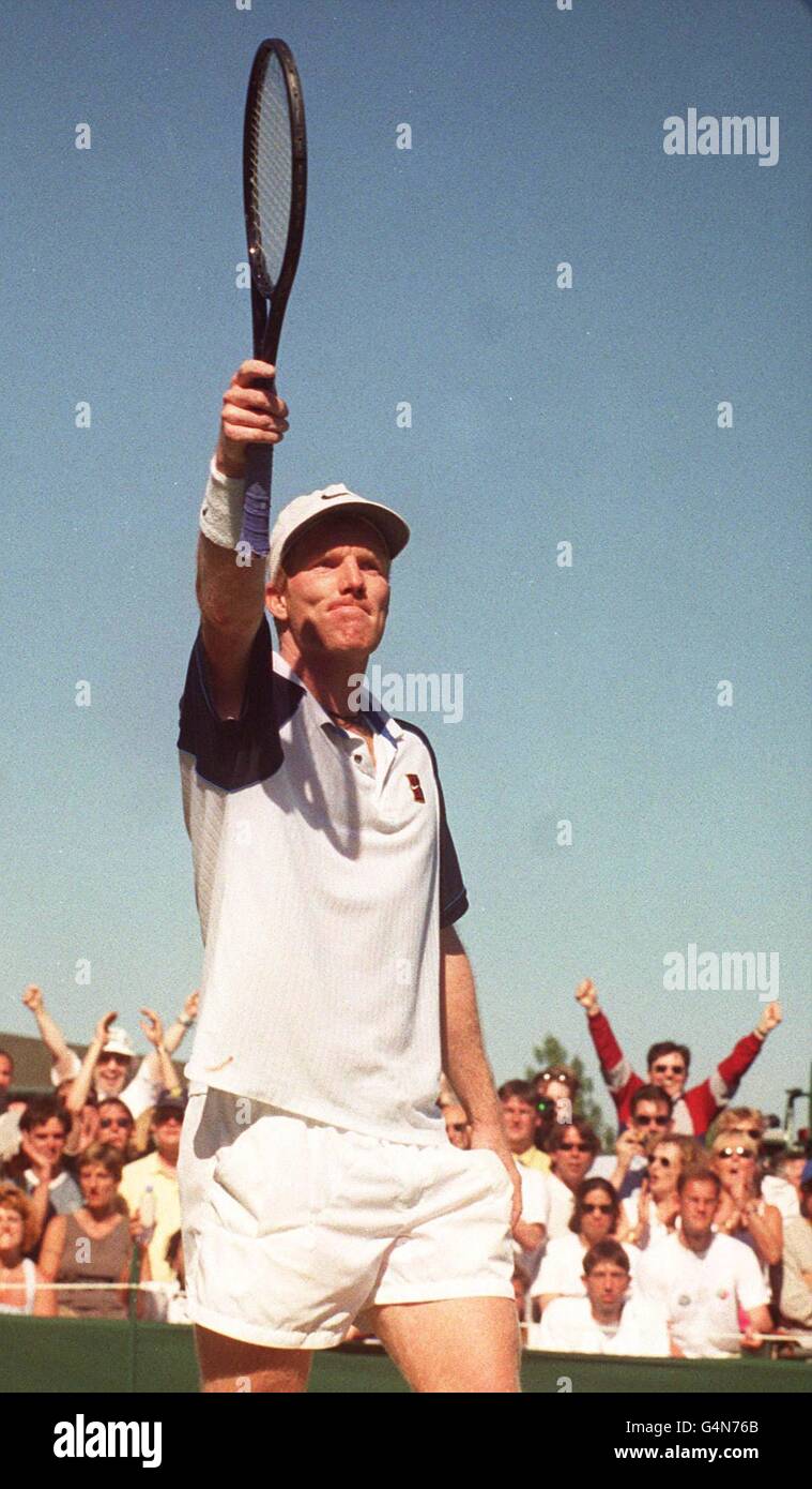 No commercial use. American Jim Courier celebrates following his victory over Netherlands Sjeng Schalken, at the 1999 Wimbledon tennis Championships. Stock Photo