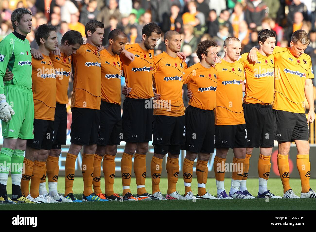 Soccer - Barclays Premier League - Wolverhampton Wanderers v Wigan Athletic - Molineux. Wolverhampton Wanderers players observe a minutes silence for rememberance day Stock Photo