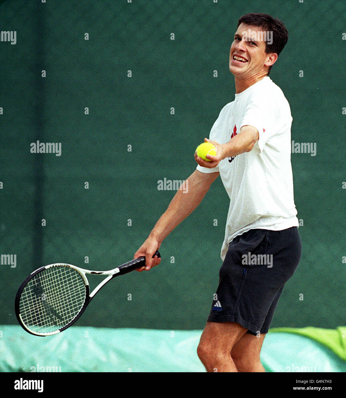 No Commercial Use: British tennis star Tim Henman in action during a practice session at the Wimbledon Tennis Championships. Henman is due to finish his match against Jim Courier. Stock Photo