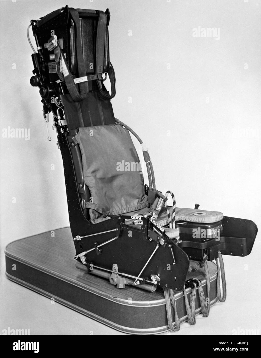 A close-up of a Martin-Baker ejection seat, supplied to the air forces of 68 nations by the firm of Higher Denham, near Uxbridge. Five thousand lives have been saved by this method. After ejection the airman is let down by parachute. Since the first emergency ejection on May 30th 1949, ejections have occurred under all conditions of flight from zero speed and zero altitude to speeds as high as 7000 knots IAS and altitudes as high as 57,000 ft. Successful ejections have been performed under water. Stock Photo