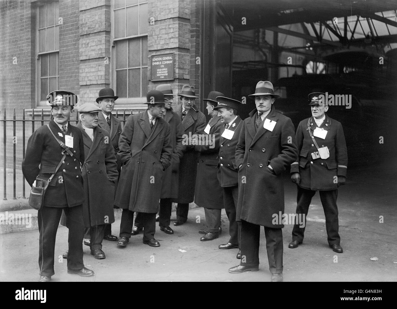 Pickets take part in a discussion outside the Warner Road Garage at Camberwell as the London Bus Strike spread Stock Photo