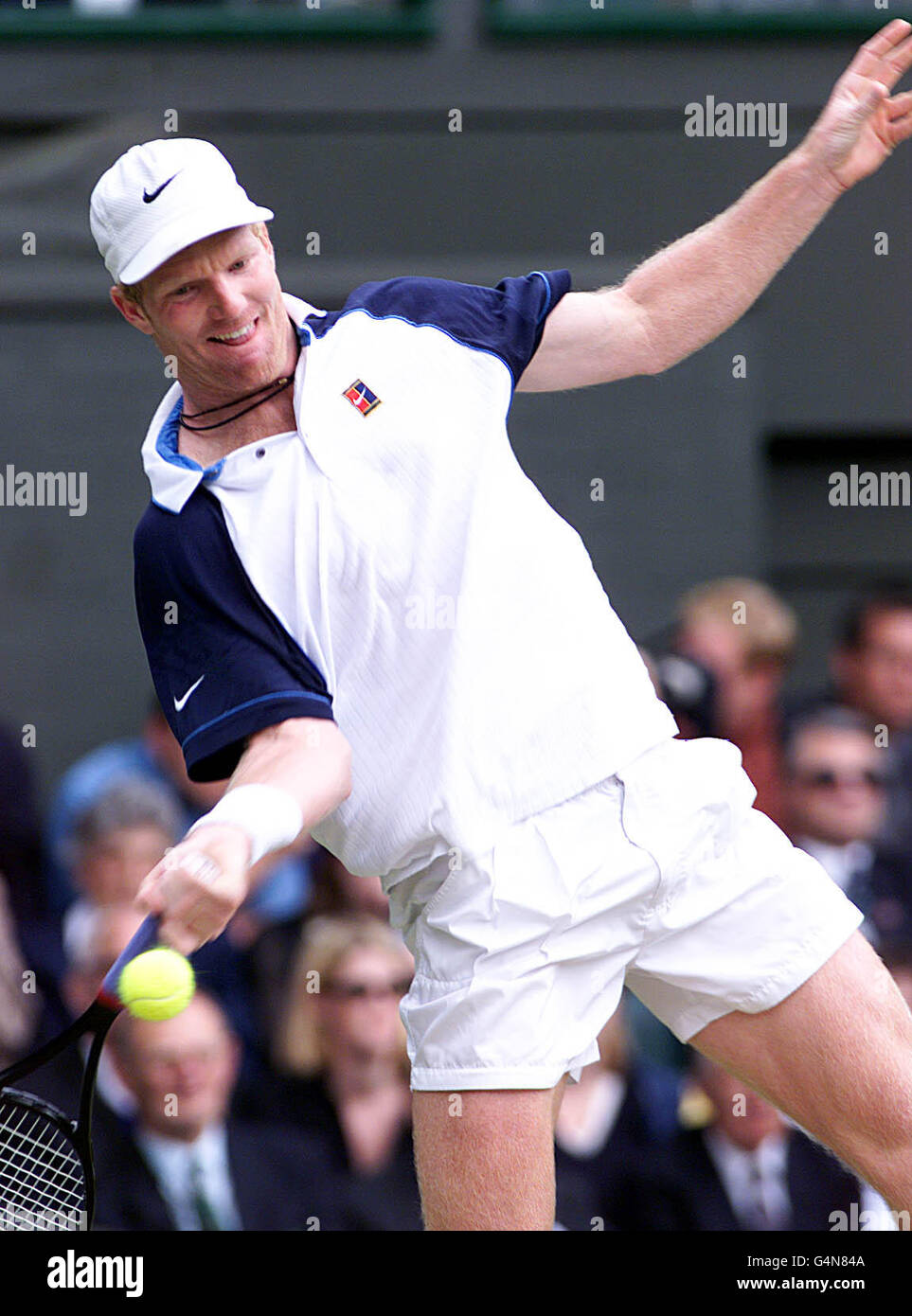 No commercial use. American Jim Courier in action during his match against Tim Henman, at the 1999 Wimbledon tennis Championships. Stock Photo