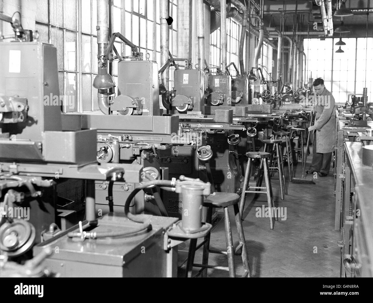 Machines stand idle in a deserted factory workshop on Great West Road, London, after drastic fuel cuts caused the cessation of production Stock Photo