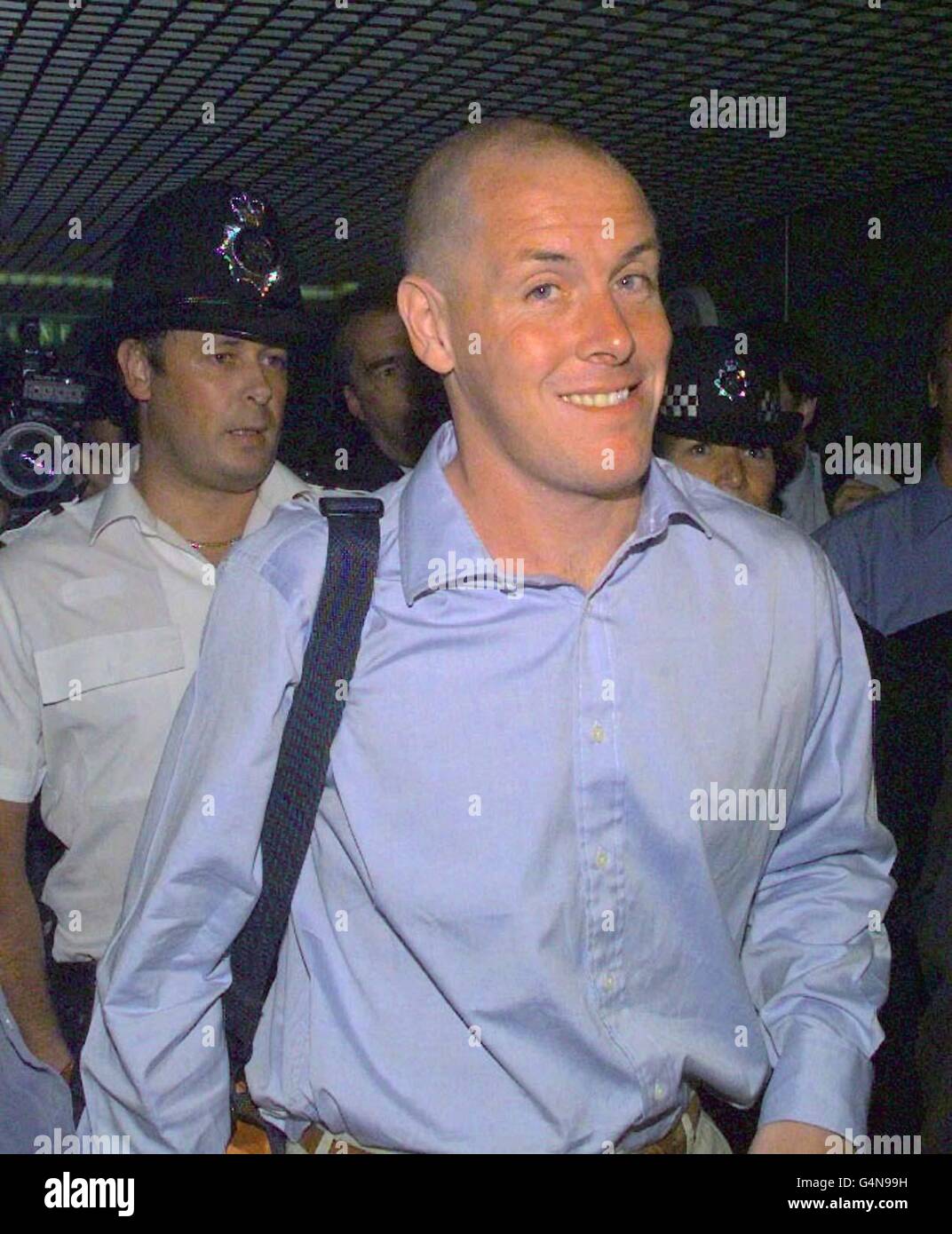Rogue trader Nick Leeson, who brought down Barings Bank, makes his way to a news conference at London's Heathrow airport. The day after Leeson was released from a Singapore jail. Stock Photo