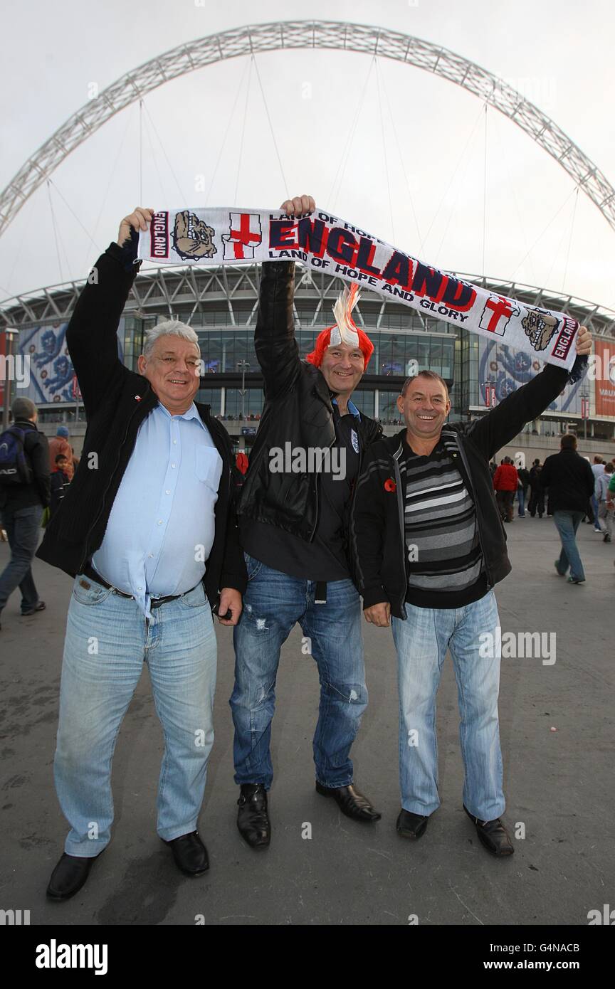 George, Dave and Steve Brown from Walsall show their support before the match outside Wembley Stadium Stock Photo