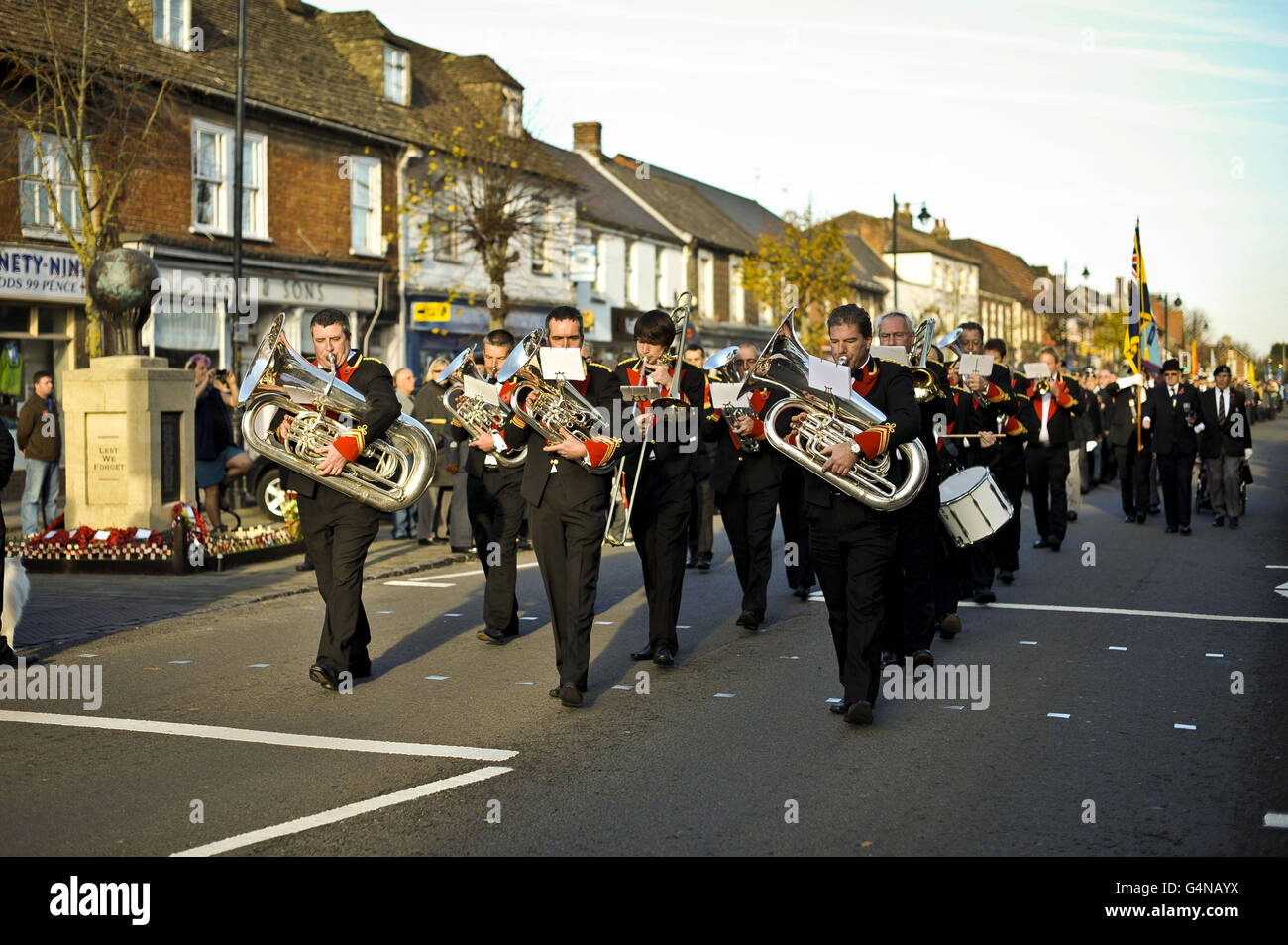 Remembrance Sunday. A band leads the march past the war memorial at Royal Wootton Bassett on Remembrance Sunday. Stock Photo