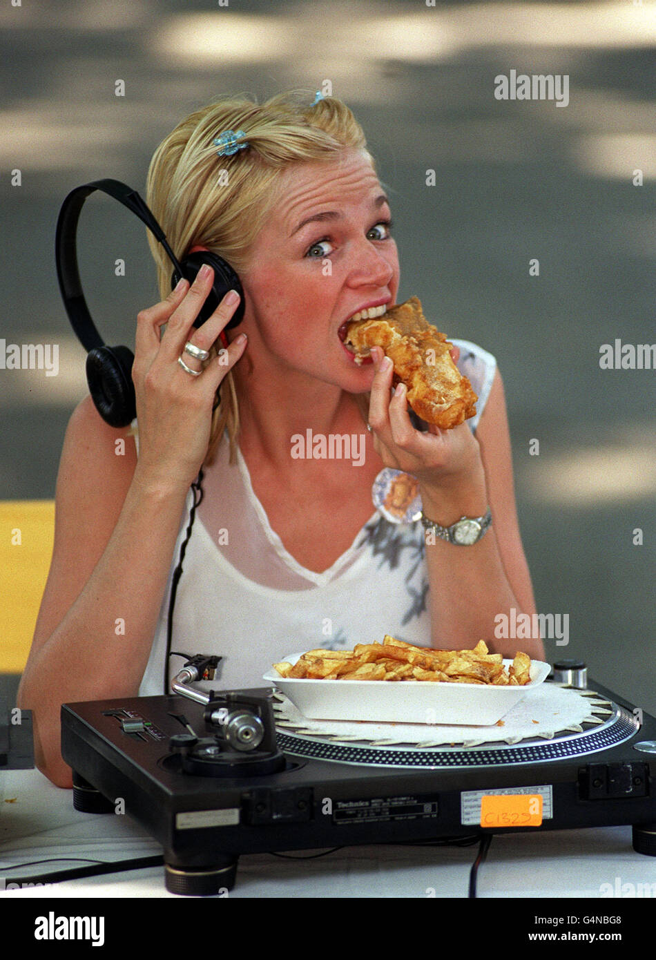 Disc Jockey (DJ) Zoe Ball became a full member of the Fish and Chip fan club in Islington, London. As a club member Zoe is dedicated to celebrate the nation's dish, it's history, regional differences. Stock Photo
