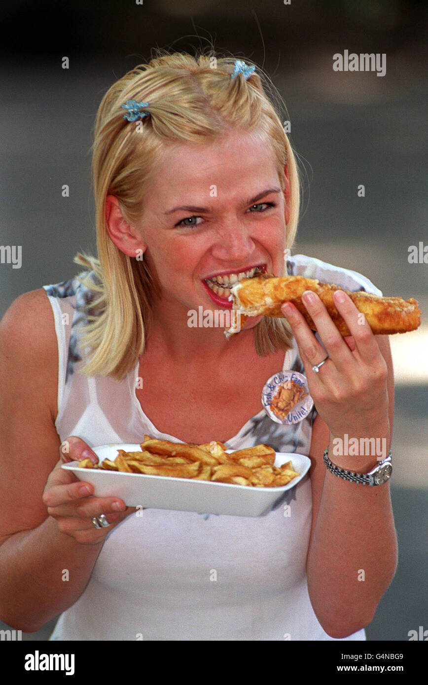 Disc Jockey (DJ) Zoe Ball became a full member of the Fish and Chip fan club in Islington, London. As a club member Zoe is dedicated to celebrate the nation's dish, it's history, regional differences. Stock Photo