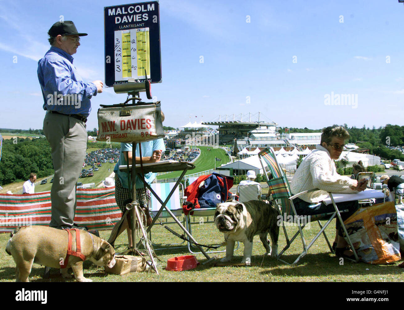 Bookmakers (and canine companions) at work in front of Goodwood race ...